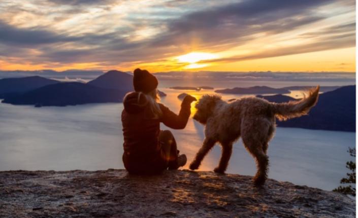 Woman hiking with dog